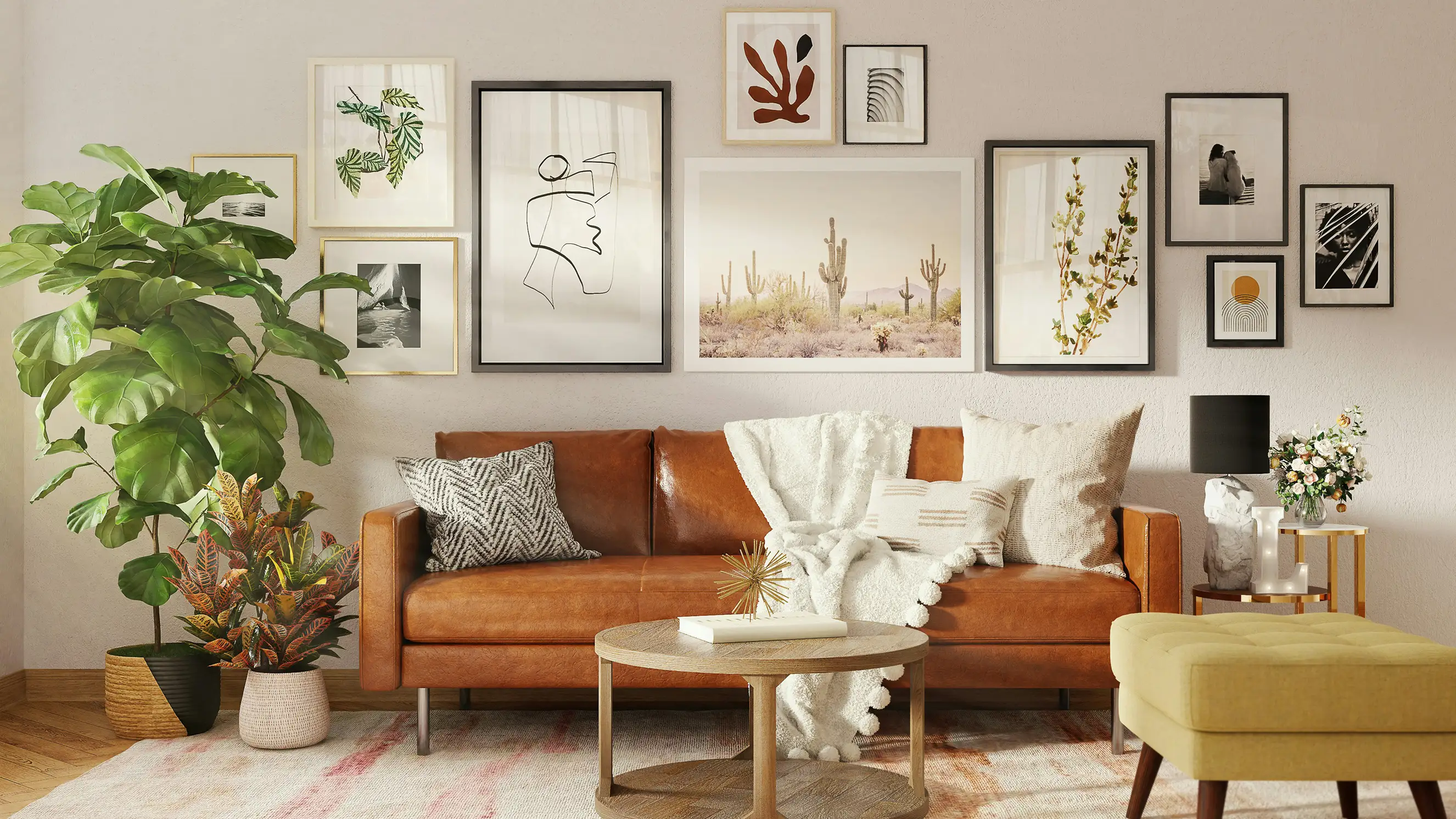 Living room with a tan leather sofa beneath a gallery wall of framed prints